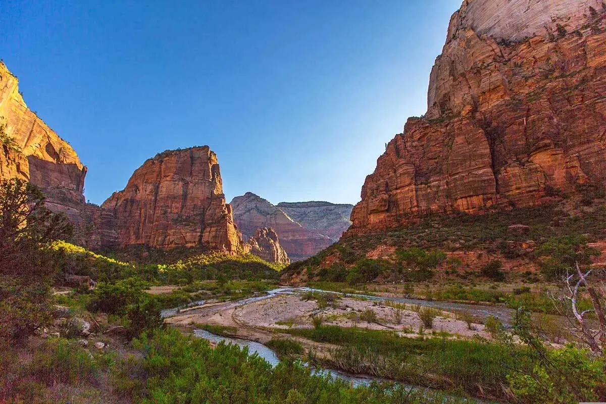 Breathtaking view of the towering sandstone cliffs of Zion Canyon, and the Virgin River meandering through the canyon