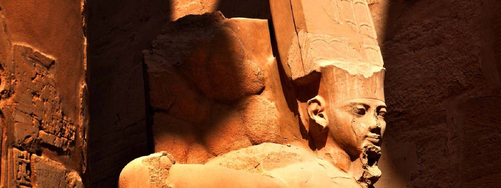 A statue of an egyptian pharaoh in a temple.