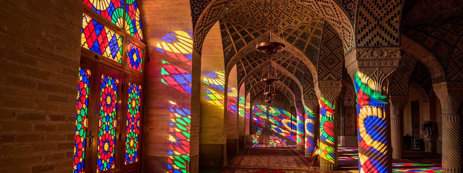 Colorful stained glass windows in a mosque.