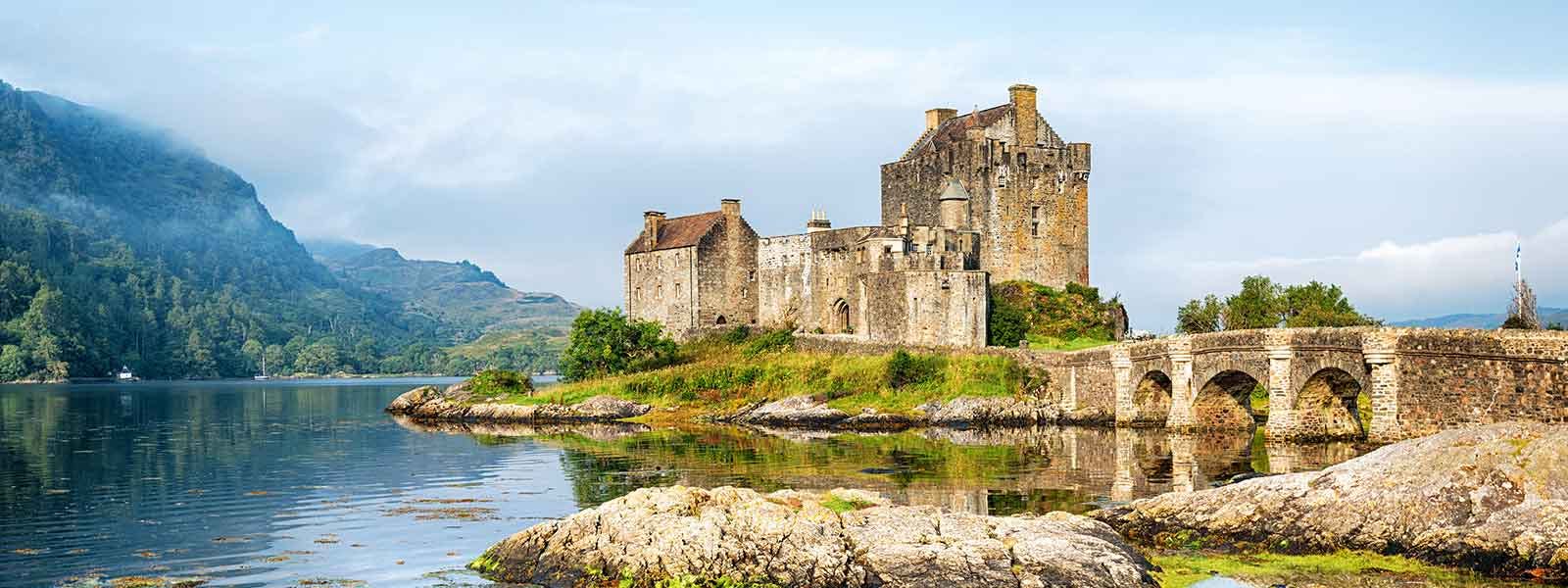 Tourists exploring the 13th century Eilean Donan Castle in the Kyle Of Lochalsh, Scotland