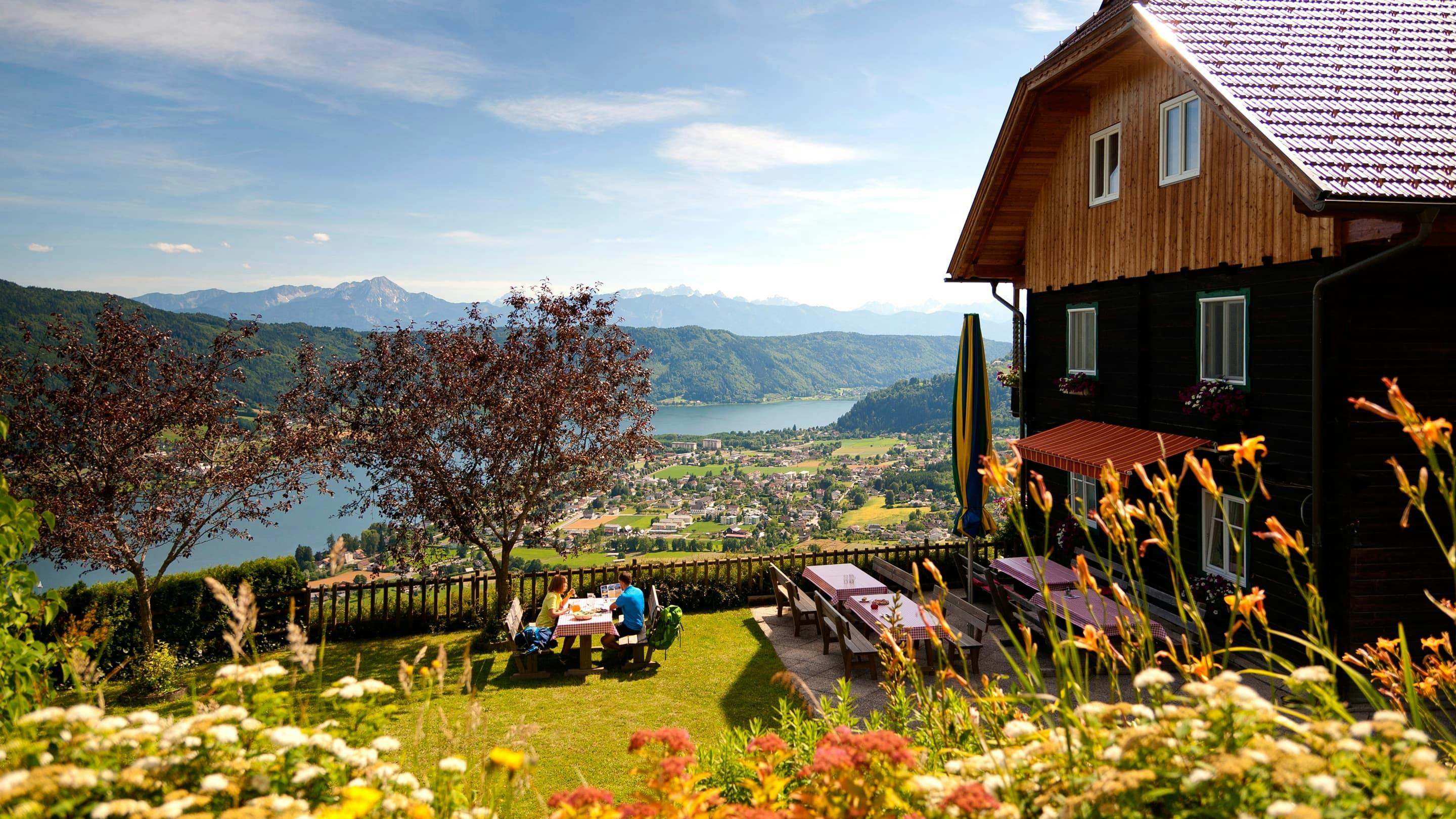 A summer house on a hill with lake views.